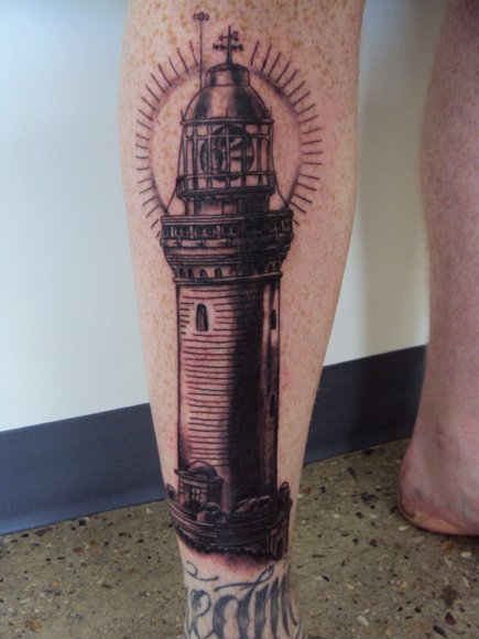 Realistic Calf Lighthouse Tattoo by Bad Apples Tattoo