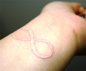 white ink infinity tattoo