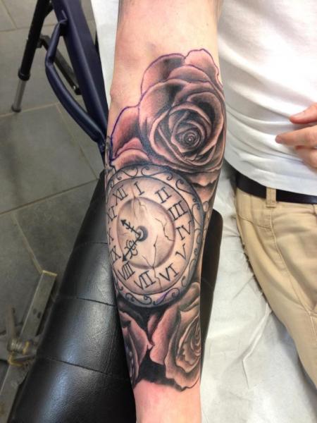 Arm Realistic Clock Flower Tattoo by Evolution Tattoo