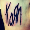 Side Lettering Korn tattoo by Adrenaline Vancity