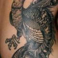 tatuaje Lado Pavo real por Gold Rush Tattoo