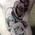 Flower Side Skull tattoo by Graceland Tattoo