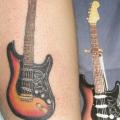 tatuaje Brazo Realista Guitarra por House of Ink
