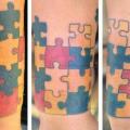 Arm Puzzle tattoo von Inkd Chronicles
