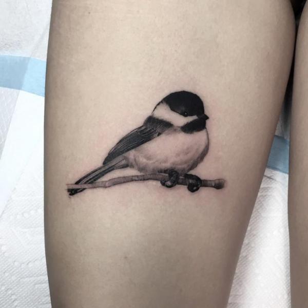 Realistic Bird Thigh Tattoo by Invisible Nyc