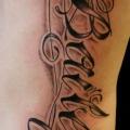 Side Lettering tattoo by Omaha Tattoo