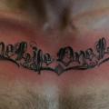 Chest Lettering Fonts tattoo by Rebellion Tattoo