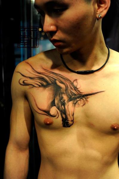 Chest Unicorn Tattoo by Tattoo Temple