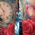 tatuaje Brazo Reloj Flor por Khan Tattoo