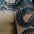Schulter Brust Drachen tattoo von Tattoo HM