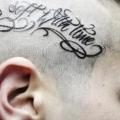 Leuchtturm Kopf Fonts tattoo von Tattoo Loyalty