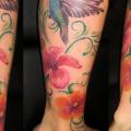 Realistic Leg Flower Birds tattoo by Baltic Tattoo
