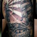 Realistic Lighthouse Rudder Thigh tattoo by Medusa Tattoo