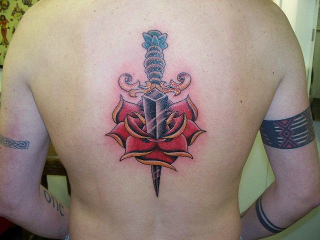 Flower Back Dagger Tattoo by Tattoo Zoo