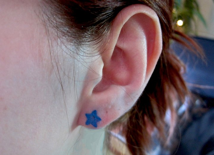 Star Head Ear Tattoo by Rainfire Tattoo