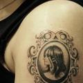 Shoulder Women Medallion tattoo by Rainfire Tattoo
