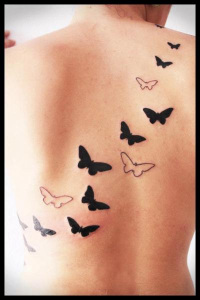 Tatuaje Espalda Mariposa por Four Roses Tattoo
