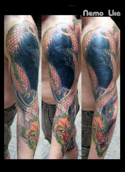 Tatuaggio Spalla Braccio Draghi di Nautilus Tattoo Gallery