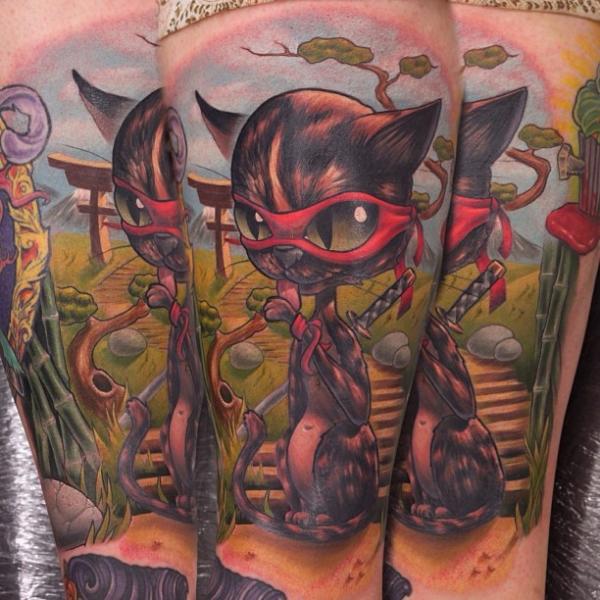 Arm Fantasy Cat Character Tattoo by Nemesis Tattoo