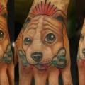 Dog Hand tattoo by Nemesis Tattoo