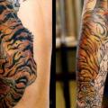 tatuaje Brazo Tigre Muslo por Scapegoat Tattoo