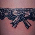 Ribbon Thigh Garter tattoo by Vaso Vasiko Tattoo