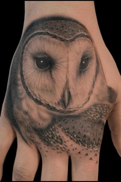 Realistic Hand Owl Tattoo by Spider Monkey Tattoos