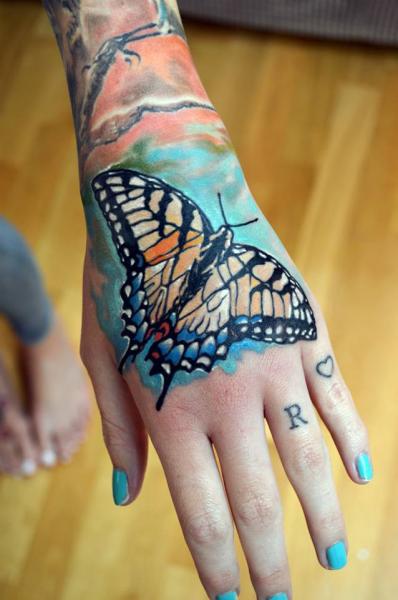 Hand Butterfly Tattoo by Otzi Tattoos