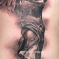 Side Religious Statue tattoo by V Tattoos
