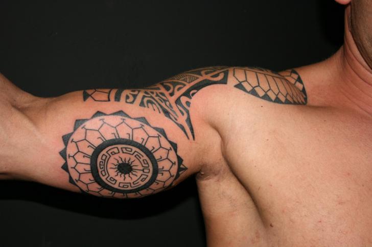 Shoulder Arm Tribal Tattoo by Wanted Tattoo