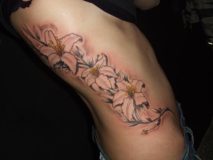 Flower Side Tattoo by Wanted Tattoo