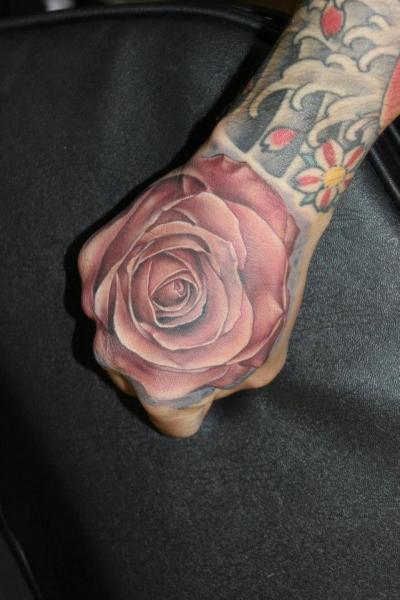 Realistic Flower Hand Tattoo by North Side Tattooz