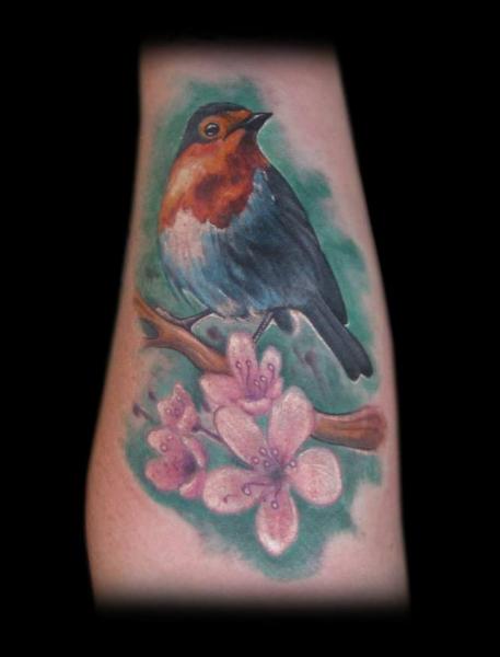 Realistic Flower Bird Tattoo by Tattoo Chaman