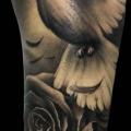 Arm Realistic Flower Bird tattoo by Demon Tattoo