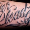 Arm Lettering tattoo by Saved Tattoo