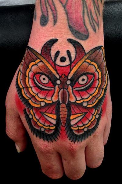 Old School Hand Moth Tattoo by Montalvo Tattoos