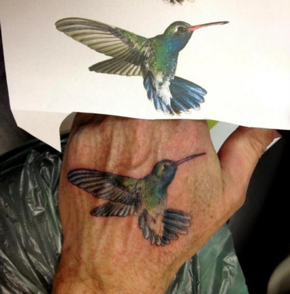Realistic Hand Hummingbird Tattoo by Dingo Tattoo
