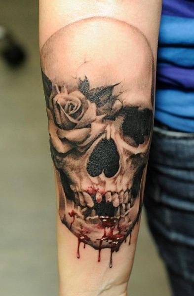 Arm Flower Skull Blood Tattoo by Radical Ink