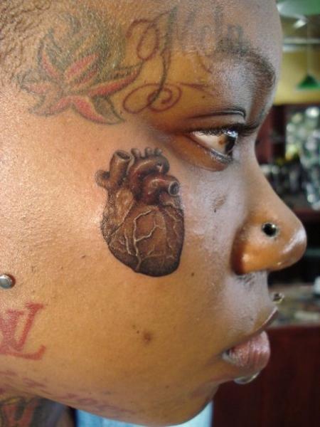 Realistic Heart Face Tattoo by Power Tattoo Company