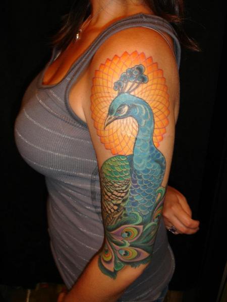Arm Realistic Peacock Tattoo by Pioneer Tattoo