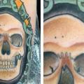 Arm Skull Medallion tattoo by Matt Adamson
