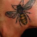 Hand Bee tattoo by Chad Koeplinger