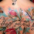 Flower Lettering Back tattoo by Delirium Tattoo
