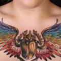 Scrabble Wings Breast tattoo by Heidi Hay Tattoo
