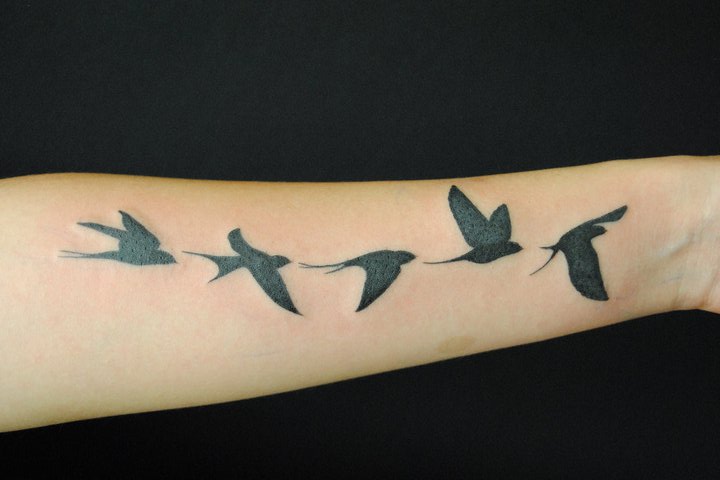 Tatuaggio Braccio Uccello di Q Tattoo