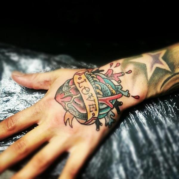 New School Heart Hand Tattoo by Stay True Tattoo