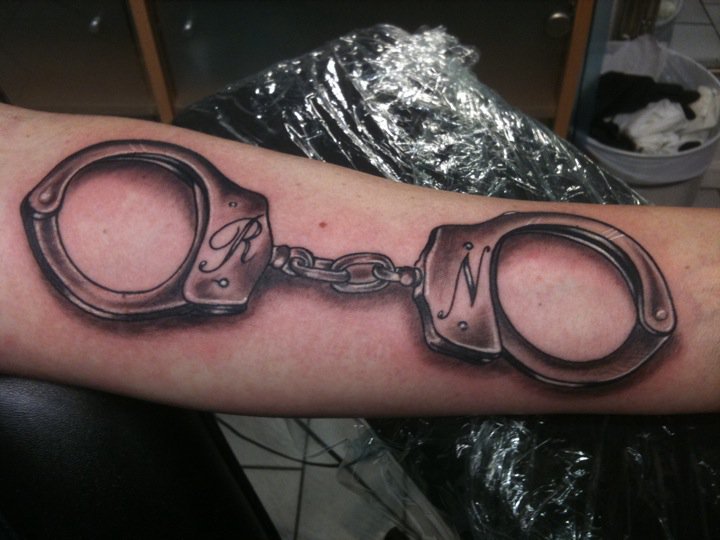 Arm 3d Handcuffs Tattoo by Stay True Tattoo
