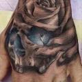 Flower Skull Hand tattoo by Art Junkies Tattoos