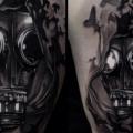 Shoulder Gas Mask Bird tattoo by Art Junkies Tattoos