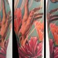 Shoulder Realistic Flower Hand Butterfly tattoo by Art Junkies Tattoos